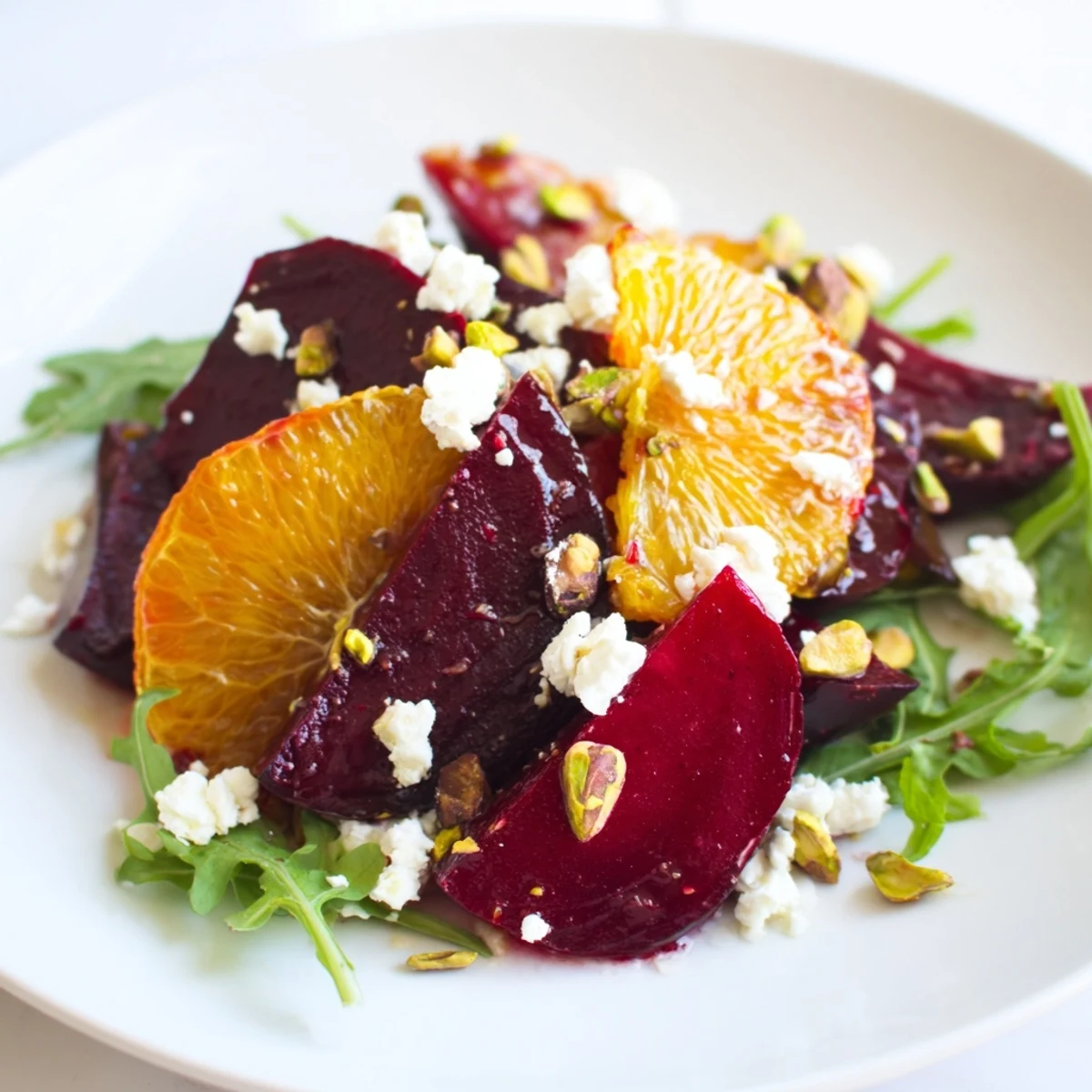 A delicious close-up of a Roasted Beet and Blood Orange Salad with pistachios for added crunch.