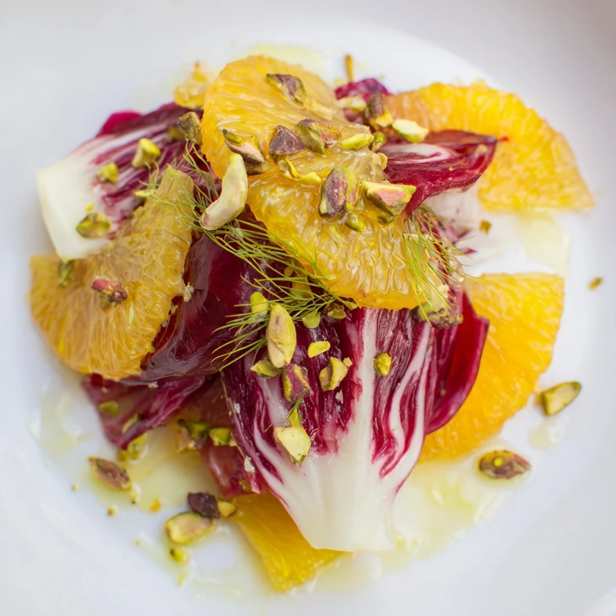 Vivid Winter Citrus Salad with Radicchio and Fennel served as a refreshing side, featuring layered orange and grapefruit rounds, shaved radicchio, and a honey-Dijon vinaigrette.  