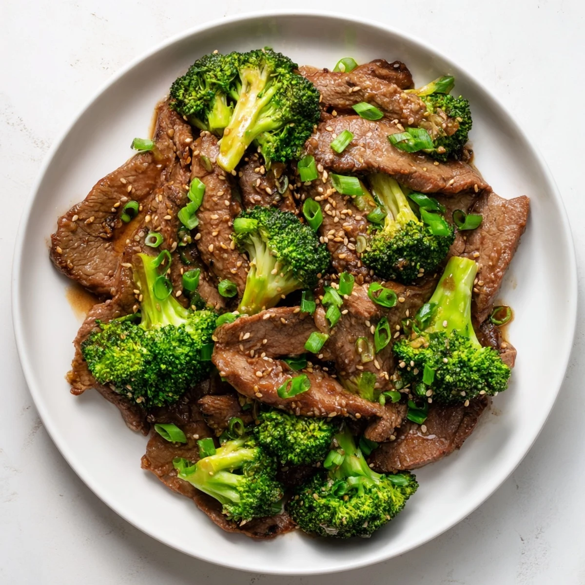 Tender beef and crisp broccoli florets glisten in a savory ginger sauce, perfect over steamed rice.