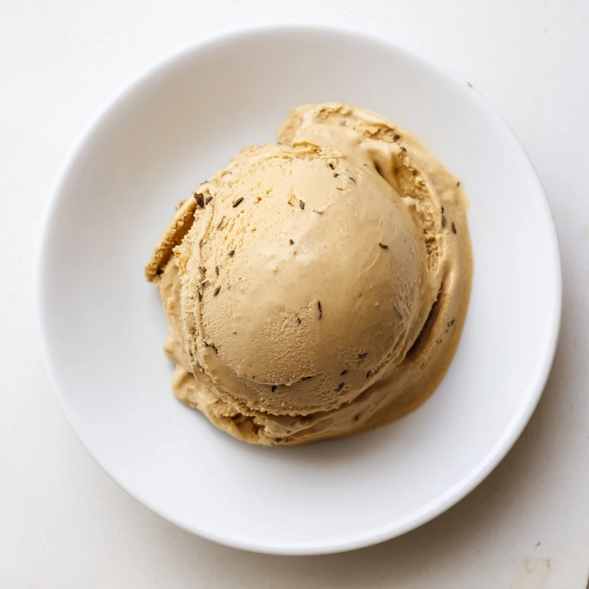 Bowl of Hojicha Ice Cream with toasted sesame seeds, a Japanese dessert suggestion.