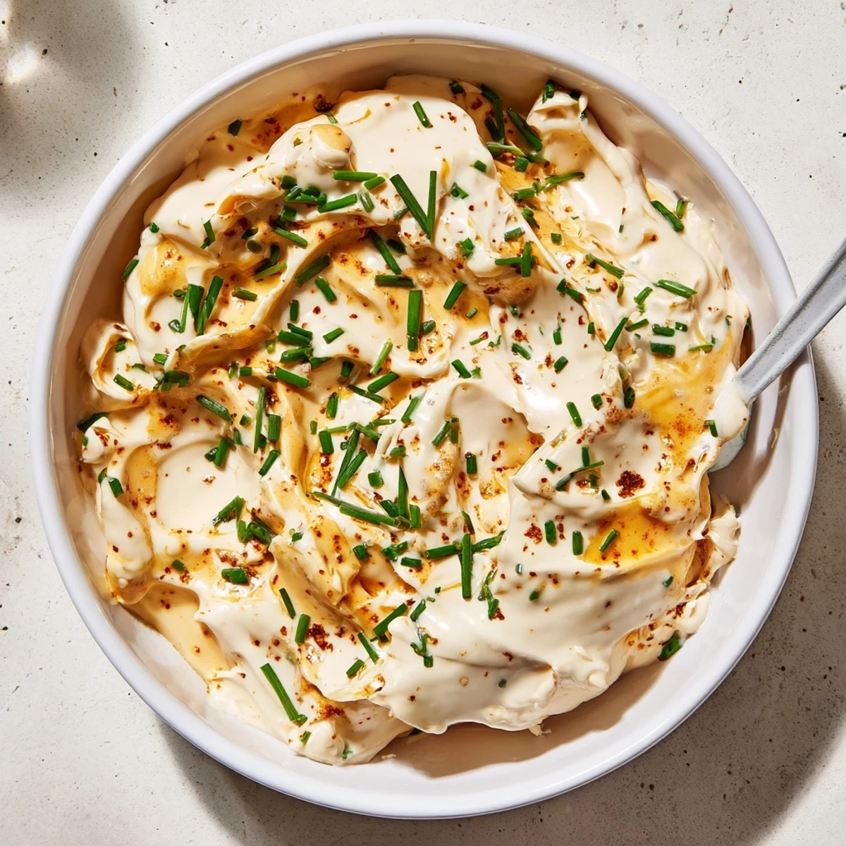 Rich and tangy savory pretzel dip featuring Dijon mustard and melted cheddar perfectly paired with salted pretzels