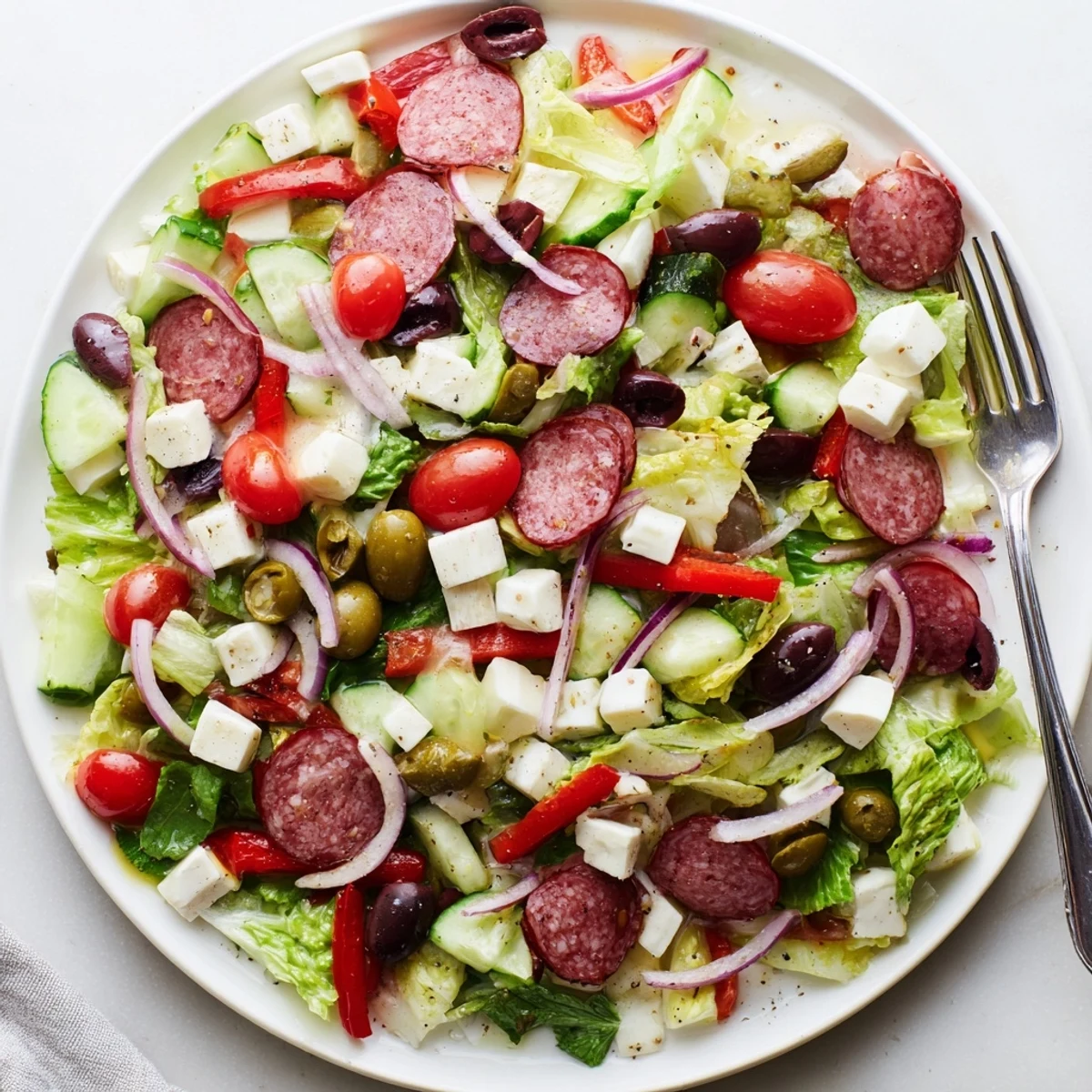 Hearty Italian chopped salad with pepperoncini, roasted red peppers, and tangy homemade vinaigrette
