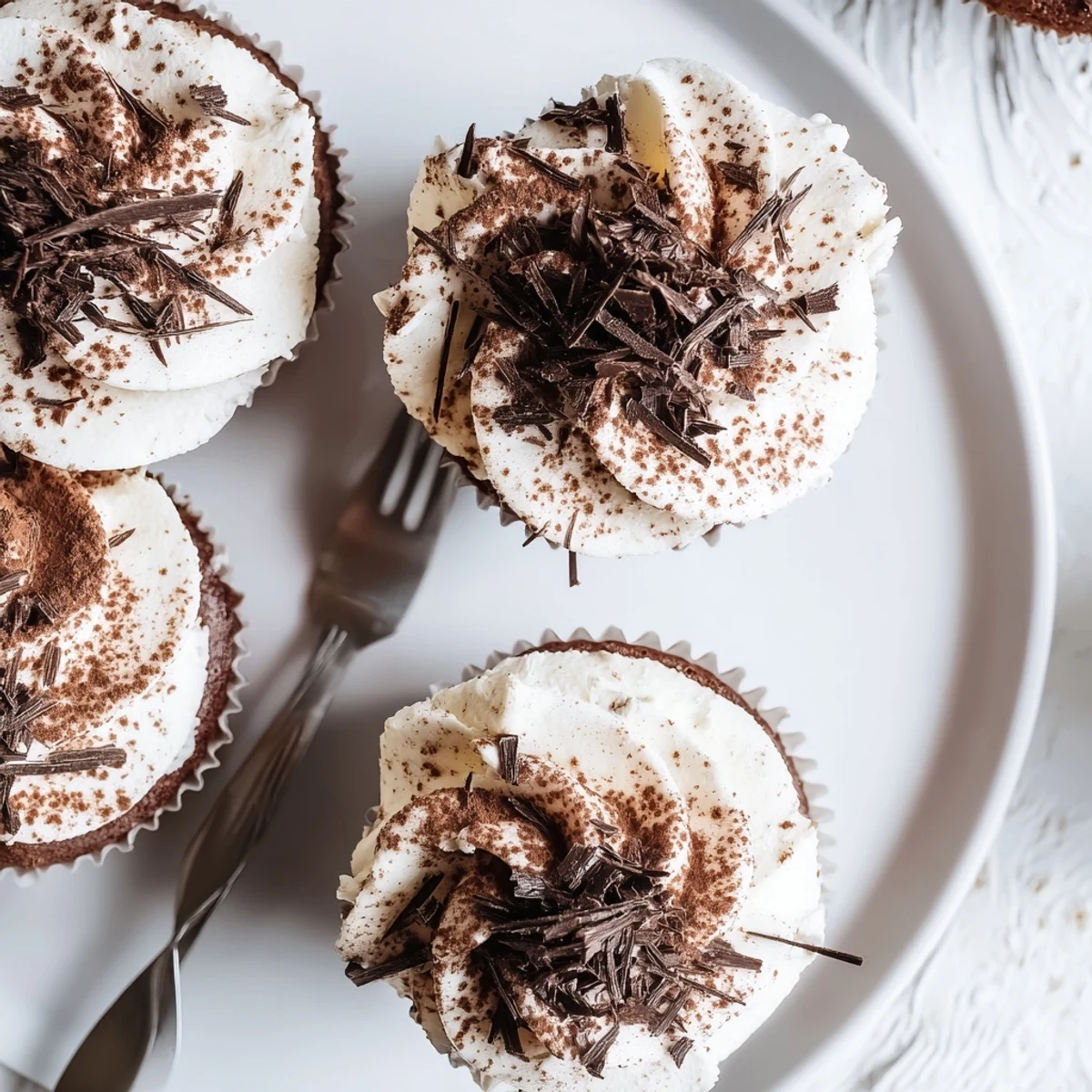 Italian-inspired chocolate tiramisu cupcakes featuring coffee-soaked layers and smooth mascarpone cheese frosting