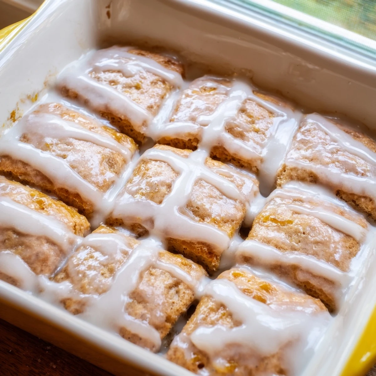 Golden peach butter swim biscuits topped with a sweet white vanilla glaze