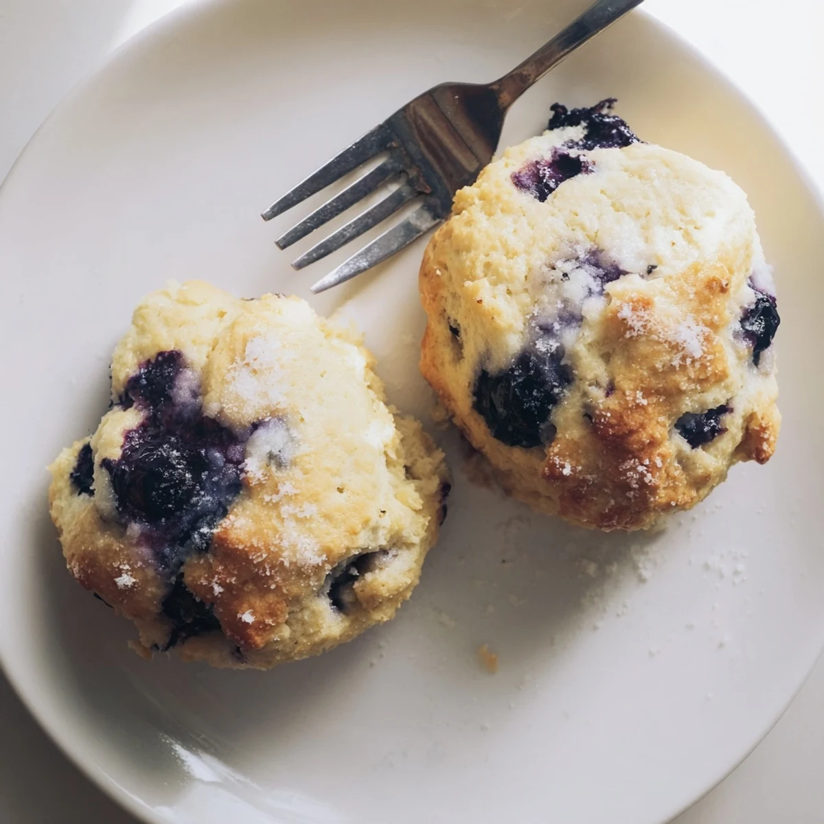 Flaky buttery biscuits bursting with juicy blueberries ready for breakfast