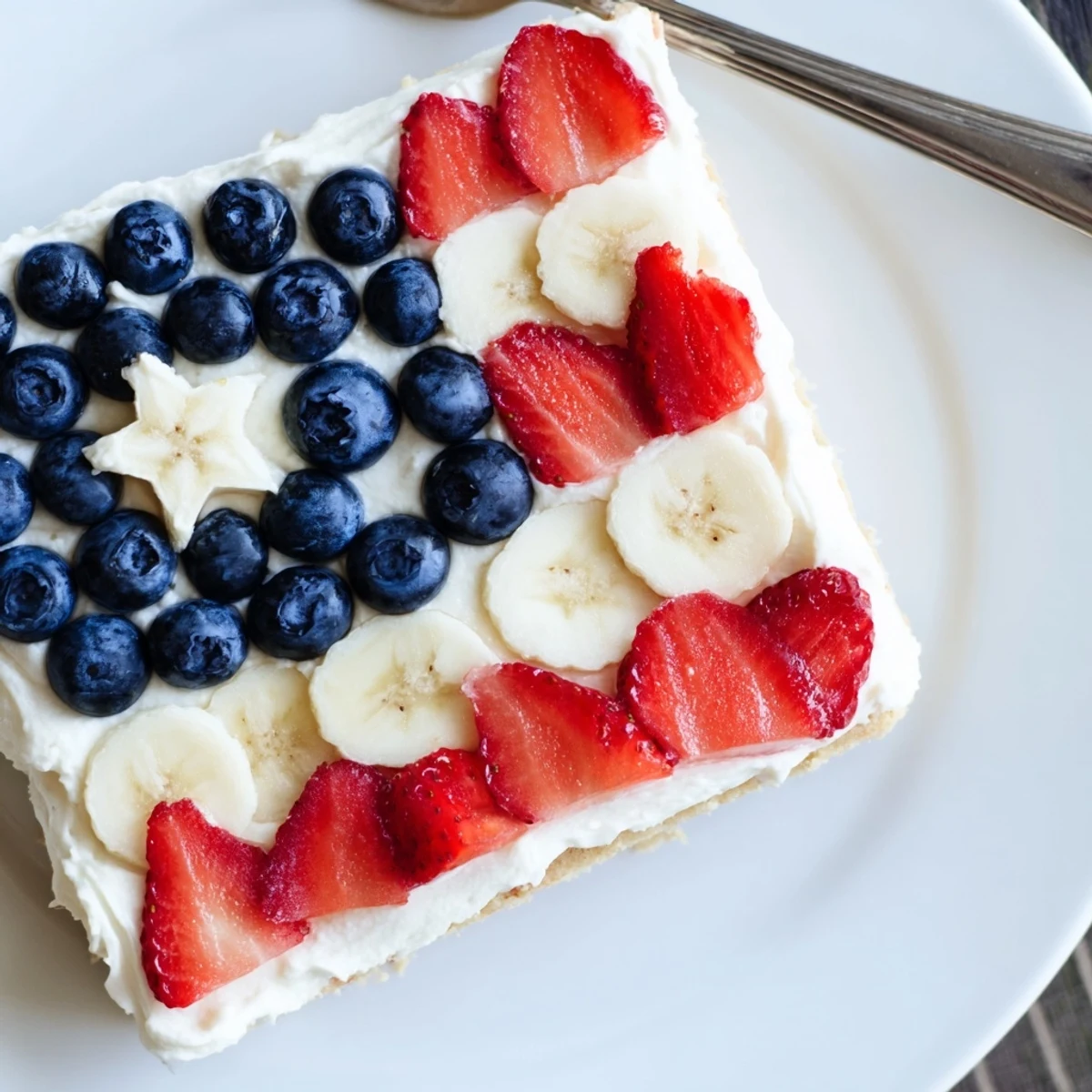 Patriotic American Flag Fruit Pizza with glossy honey glaze, creamy filling, sliced bananas