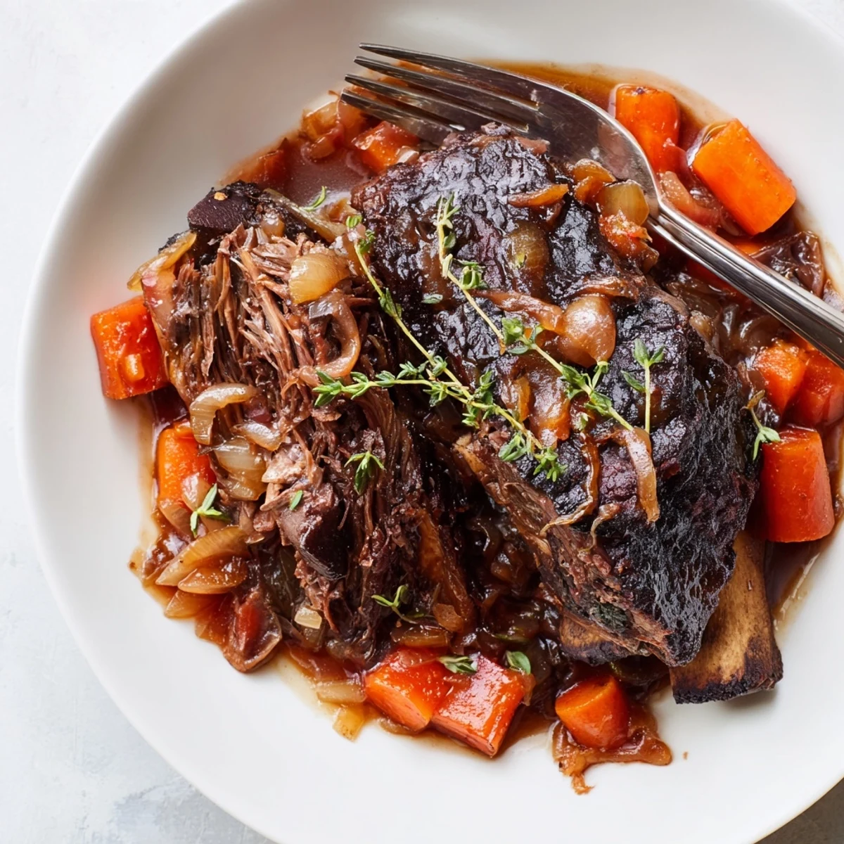 Slow Cooker Beef Short Ribs braised in Crockpot with thyme, rosemary, silky gravy