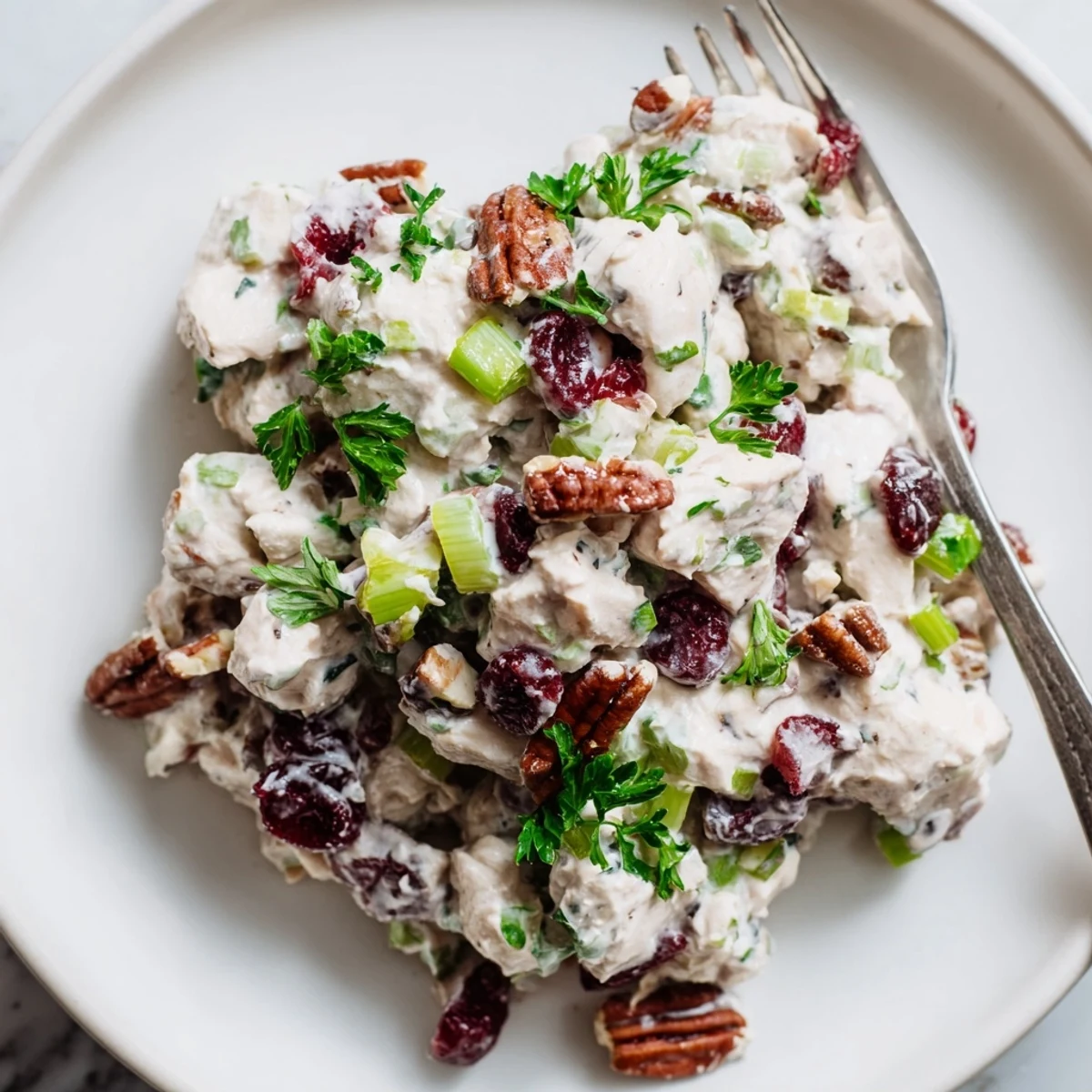 Creamy cranberry pecan chicken salad featuring tender diced chicken, sweet dried cranberries, and toasted pecans