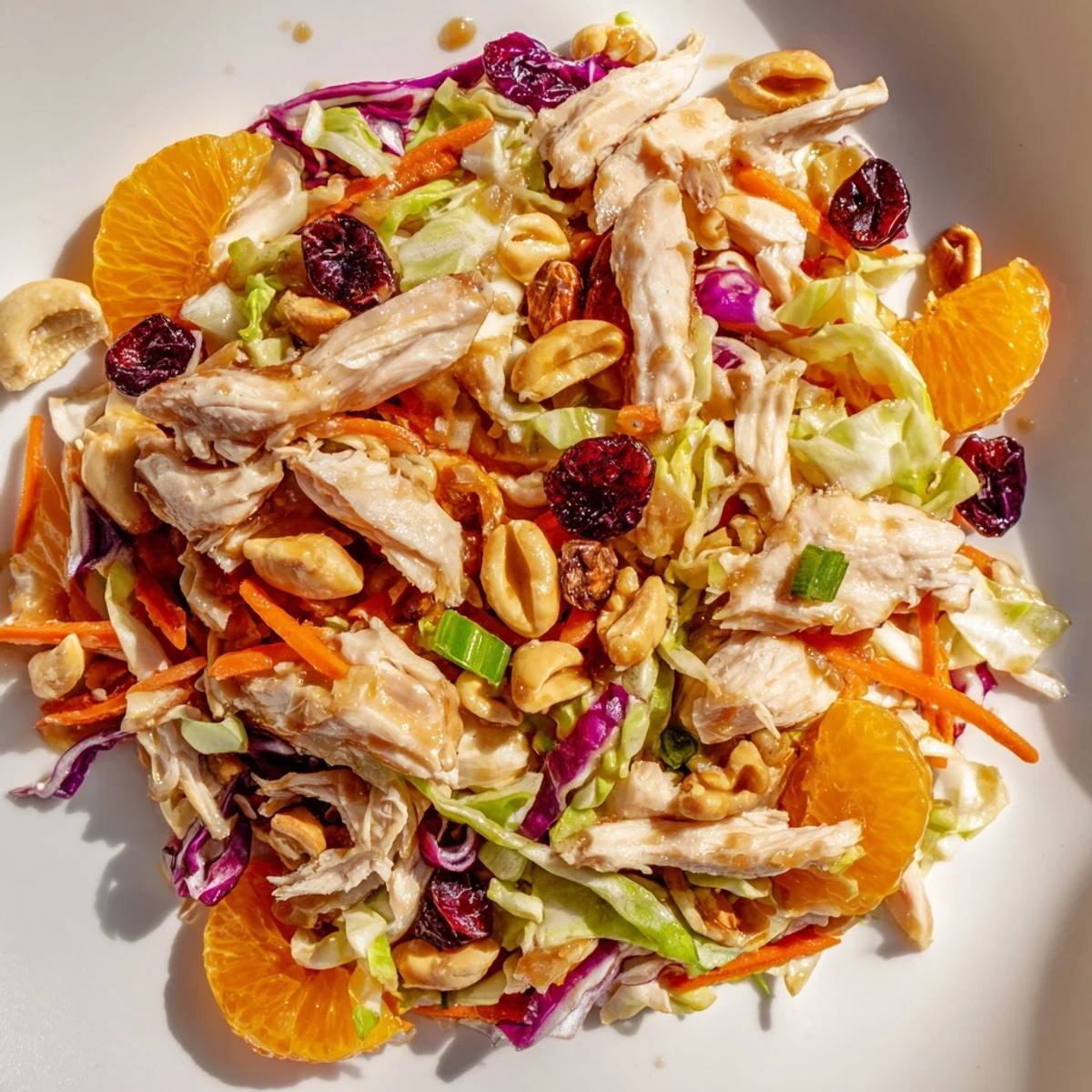 Fresh Asian chicken cranberry salad featuring crunchy vegetables, tender chicken, and sweet dried cranberries