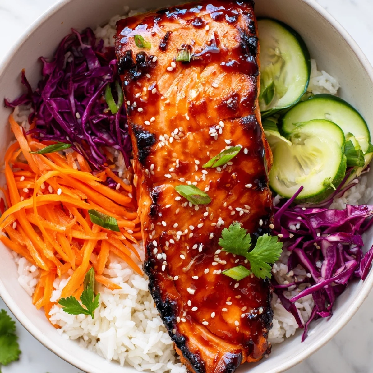 Vibrant Sriracha Honey Glazed Salmon Bowls featuring crisp vegetables and sticky glazed fillets
