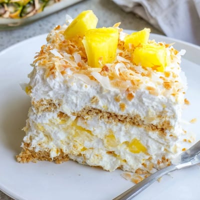 Golden graham crust anchors this no bake pineapple coconut cream cake with fluffy filling